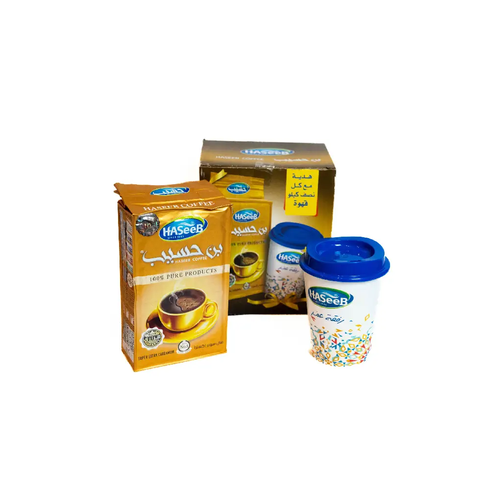 Package of Haseeb Super Extra Cardamom Coffee 500g with a complimentary glass.